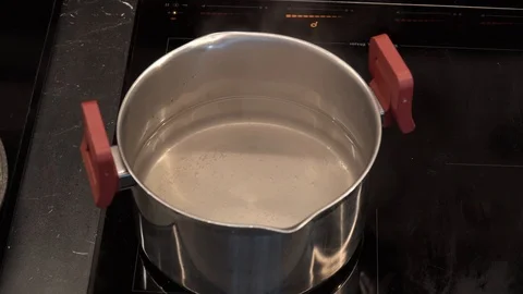 Boiling water in a pot above view Stock Footage 113528134