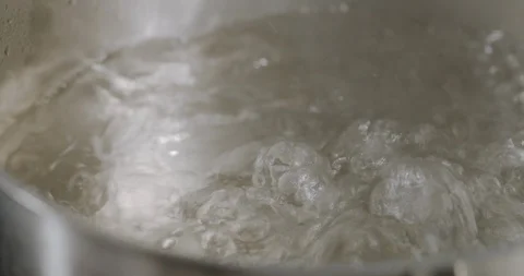 Boiling water in pot. Bubbles of boiling water. Stock Footage 124005233