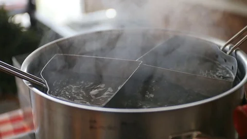 Boiling Water in a Pot Bubbling Over Stock Footage 75378433
