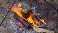 https://images.pond5.com/boiling-water-pot-cooking-campfire-footage-202124469_iconm.jpeg