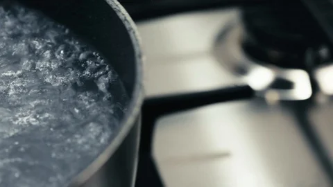 Boiling water in a pot Stock Footage 94959953