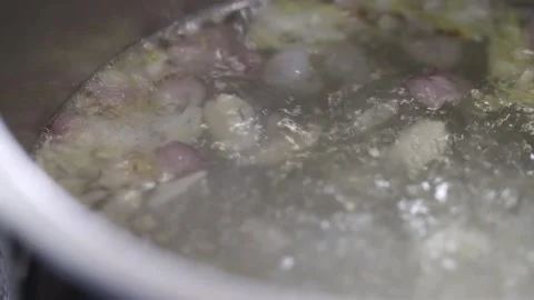Boiling water in a pot with spices Stock Footage 145354876