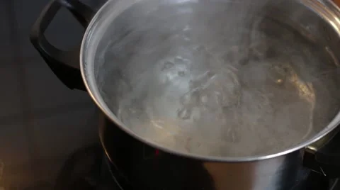 Boiling Water in a pot on a stove Stock Footage 49654512
