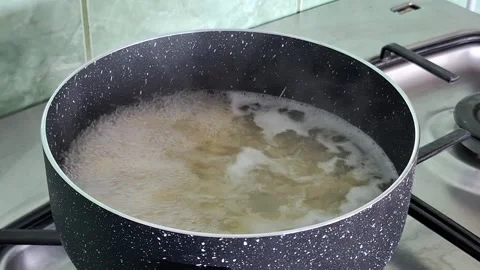 Boiling Water in a Pot on the Stove While Preparing Pasta Video stock 347660198