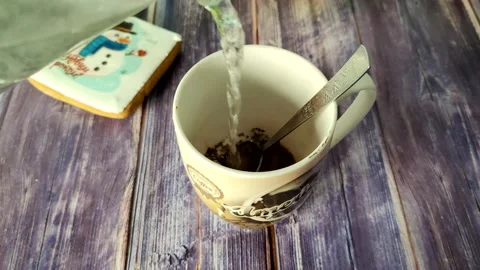 Boiling water is poured into a cup with instant coffee and sugar Stock Footage 231049454