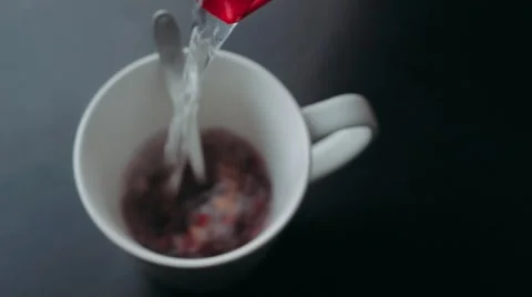Boiling water is poured into a cup of tea. Stock-Footage 48226908