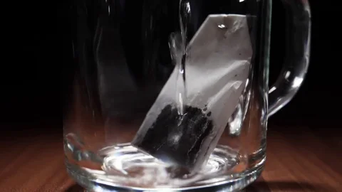 Boiling Water Is Poured In Cup With Tea Bag Stock Footage 75930822