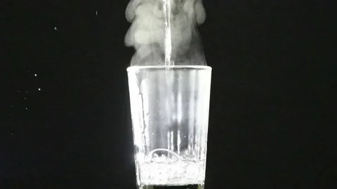 Boiling water is poured into a glass. Stock Footage 239231053