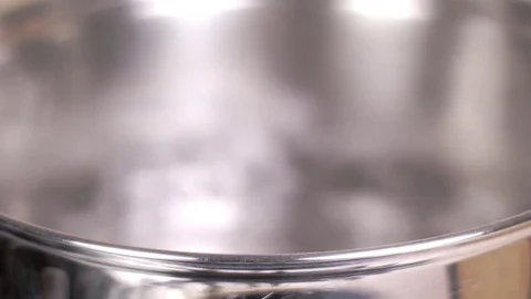 Boiling water in a saucepan Stock Footage 84793839