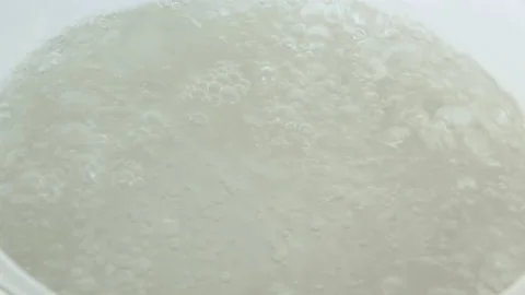 Boiling water in a saucepan. selective focus. Stock Footage 149984211