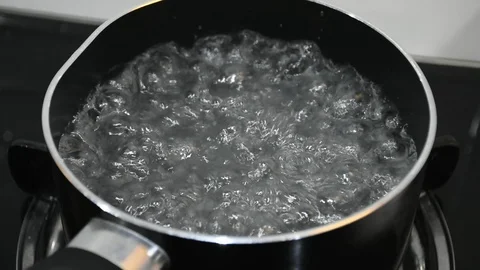 Boiling water for soup Stock Footage 88786636
