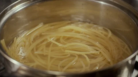 Boiling water with spaghetti in pan Stock Footage 126472081