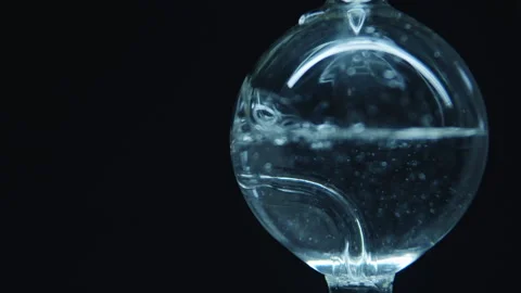 Boiling water in a spherical flask.  Stock Footage 242802076