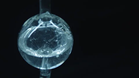 Boiling water in a spherical flask.  Stock Footage 242802093