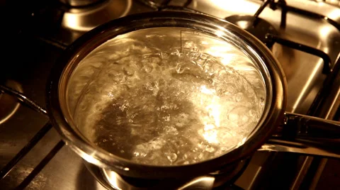 Boiling water in a stainless pot Stock Footage 49996578