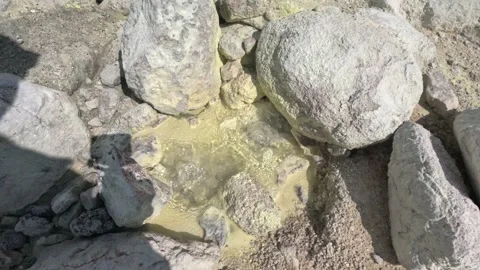 Boiling water sulfur smoke steam in mountain Lo, Hokkaido, Japan. Sunny day Stock-Footage 253464853
