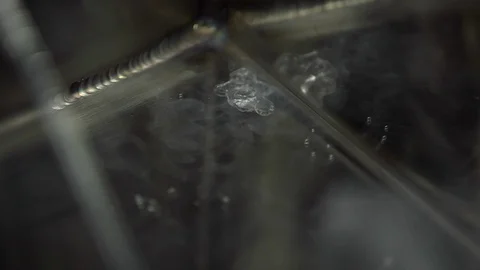 Boiling water at the surface of the tank Stock Footage 93517975