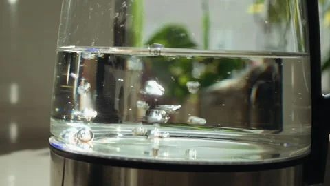 Boiling water in a teapot slow motion close-up video Stock Footage 163150801