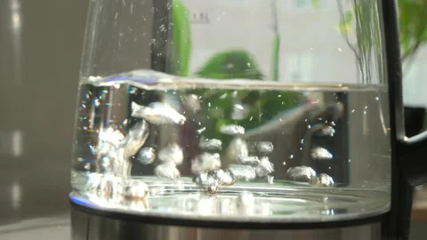 Boiling water in a teapot slow motion close-up video Video stock 163150943