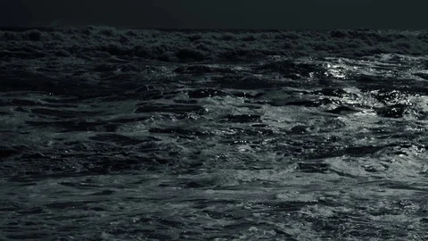 Boiling waves at night in the moonlight close Stock Footage