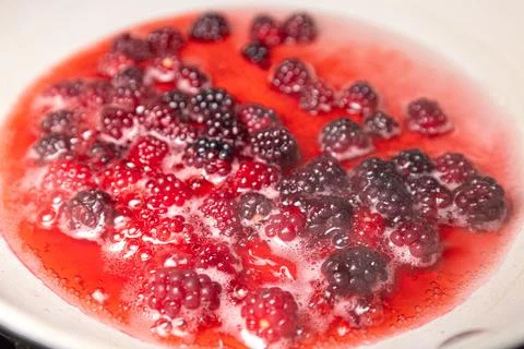 Boiling wild berries Stock Photos