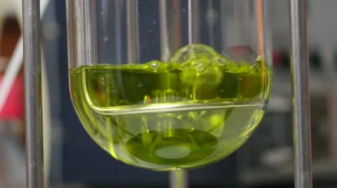 Boiling yellow liquid in fermentation reactor with oxygen laboratory. Air bubble Stock Footage 68148611