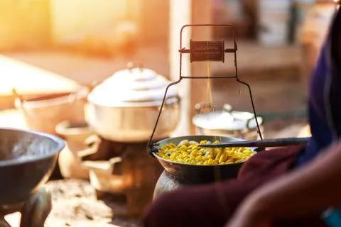 Boiling yellow silkworm cocoons by boiler to make silk thread. Stock Photos