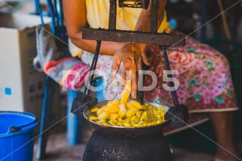 Boiling yellow silkworm cocoons by boiler to make silk thread. Stock Photos