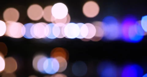 Bokeh abstract blurred background festive traffic red lights car on road sparkli Stock Footage 229595890