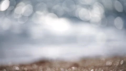 Bokeh abstract sea background of a summer ocean sunset with small waves on the Stock Footage 252427779