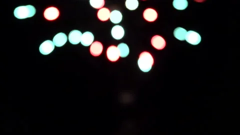 Bokeh and blur of fireworks exploding at night in the sky. Stock Footage 86298291
