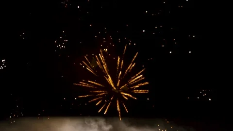Bokeh and blur of fireworks exploding at night sky. Colourful fireworks defocus Stock Footage 202282440