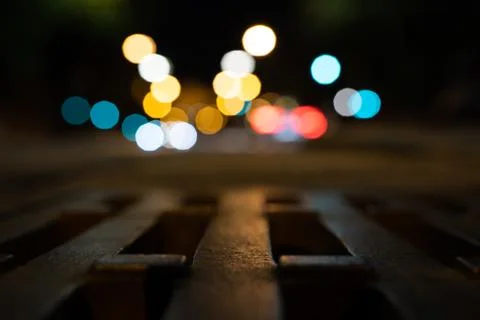 Bokeh background with traffic lights in the background. Sink in the foreground. Stock Photos