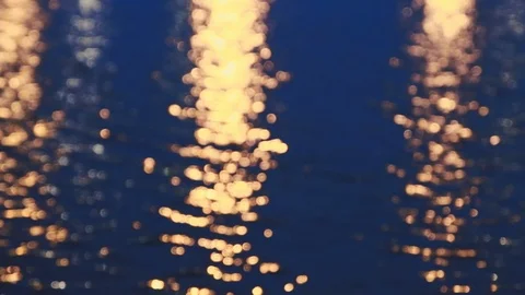 Bokeh background from a water pond on a windy night with light reflection Stock Footage 107432458