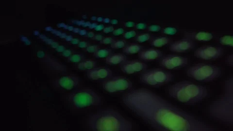 Bokeh Backlit Keyboard Close-up Zoom In Out of Focus Stock Footage 101256090
