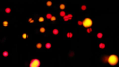 Bokeh blur on a black background colored diode rays on a black background Stock Footage 153704624