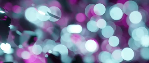 Bokeh blurred glitter balls of light abstract streaming loop background. Stock Footage 150932444