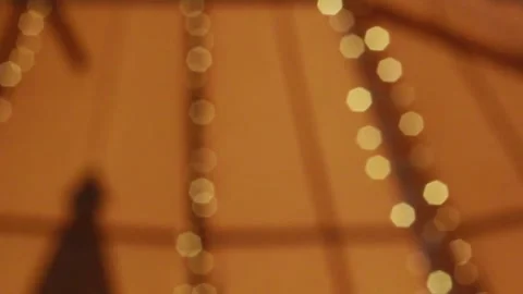 Bokeh Blurred Orange Lights Inside WigWam Bell Tent Stock Footage 139009571