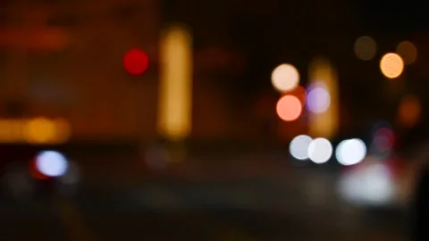 Bokeh circles created by traffic lights at night Stock Footage 294954666