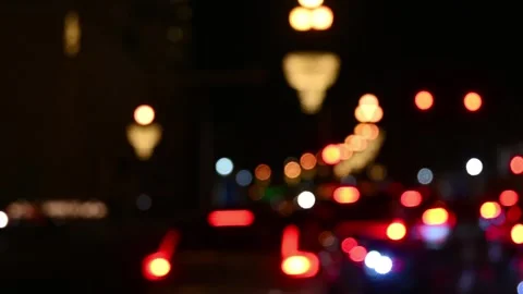 Bokeh circles created by traffic lights at night Stock Footage 294954699