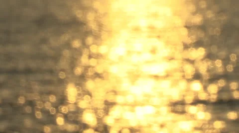 Bokeh dancing sunlight on ocean waves Stock Footage 24454272