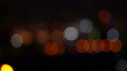 Bokeh in dark blurry background at night, Bokeh of city lights, Defocused night  Stock Footage 232830316
