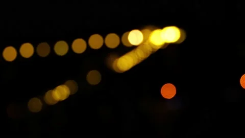 Bokeh in dark blurry background at night, Bokeh of city lights, Defocused night  Stock Footage 234042093