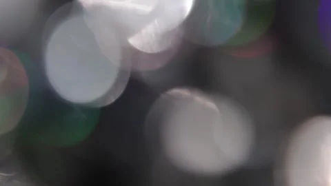 Bokeh in the dark with colored light leaks full screen Video stock 318836021