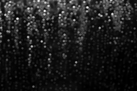 Bokeh drops on black background. Stock Photos