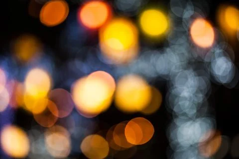 Bokeh effect background of decoration on tree by party light Stock Photos