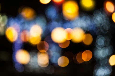 Bokeh effect background of decoration on tree by party light Stock Photos