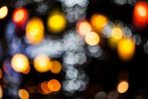 Bokeh effect background of decoration on tree by party light Stock Photos