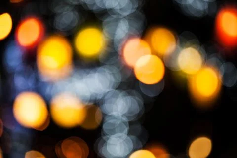 Bokeh effect background of decoration on tree by party light Stock Photos