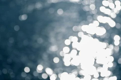 Bokeh effect.The bokeh of the lens from the surface of the water shimmering i Stock Photos